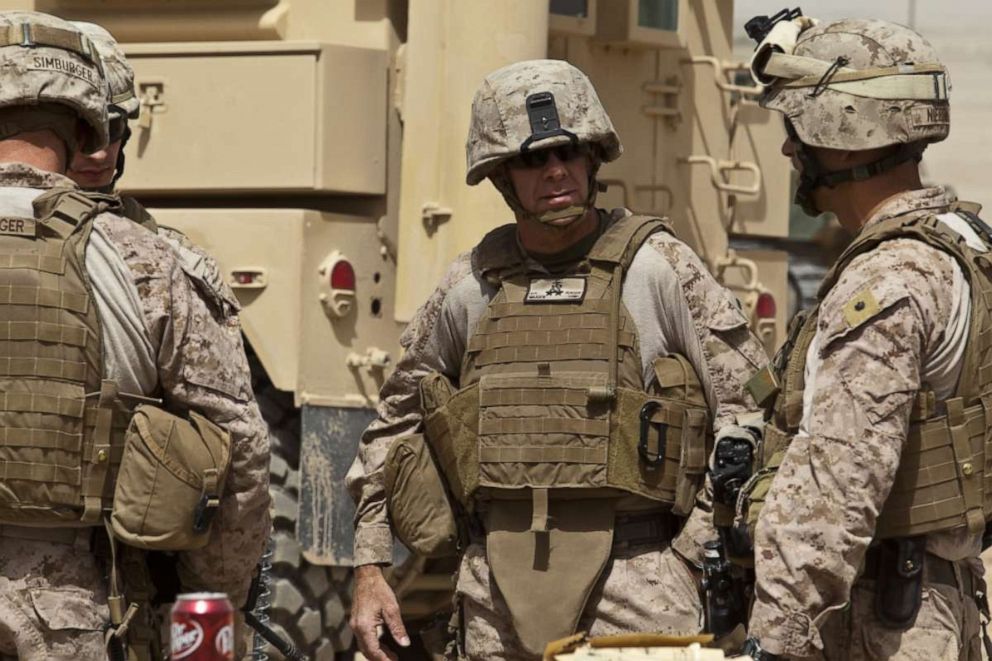PHOTO: U.S. Marine Corps Maj. Gen. David H. Berger, center, commanding general, Task Force Leatherneck, speaks to Lt. Col. Andrew Niebel, right, on Patrol Base (PB) Lazika, Helmand province, Afghanistan September 18, 2012. 