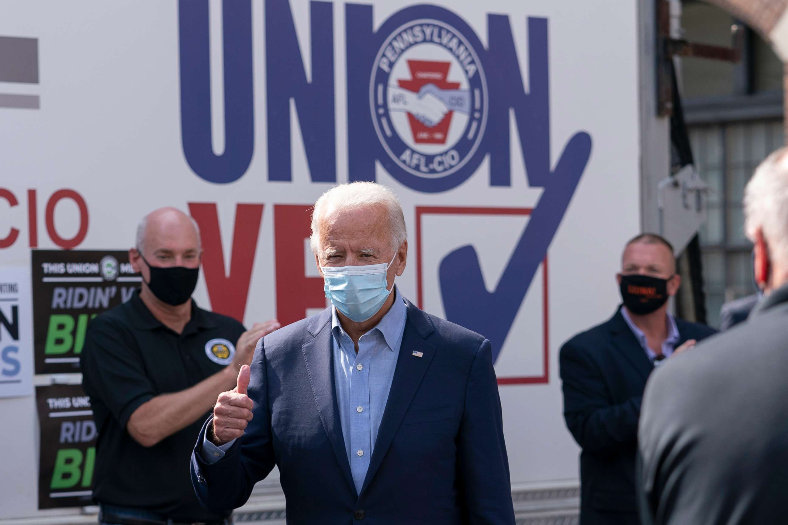 PHOTO: Democratic presidential candidate former Vice President Joe Biden gives the thumbs up as he arrives to pose for photographs with union leaders outside the AFL-CIO headquarters in Harrisburg, Pa., Sept. 7, 2020. 