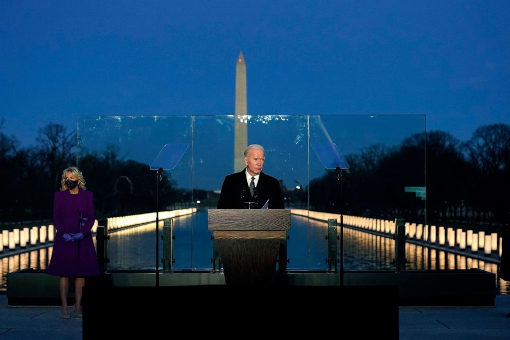 PHOTO: President-elect Joe Biden speaks during a COVID-19 memorial, with lights placed around the Lincoln Memorial Reflecting Pool, Jan. 19, 2021.