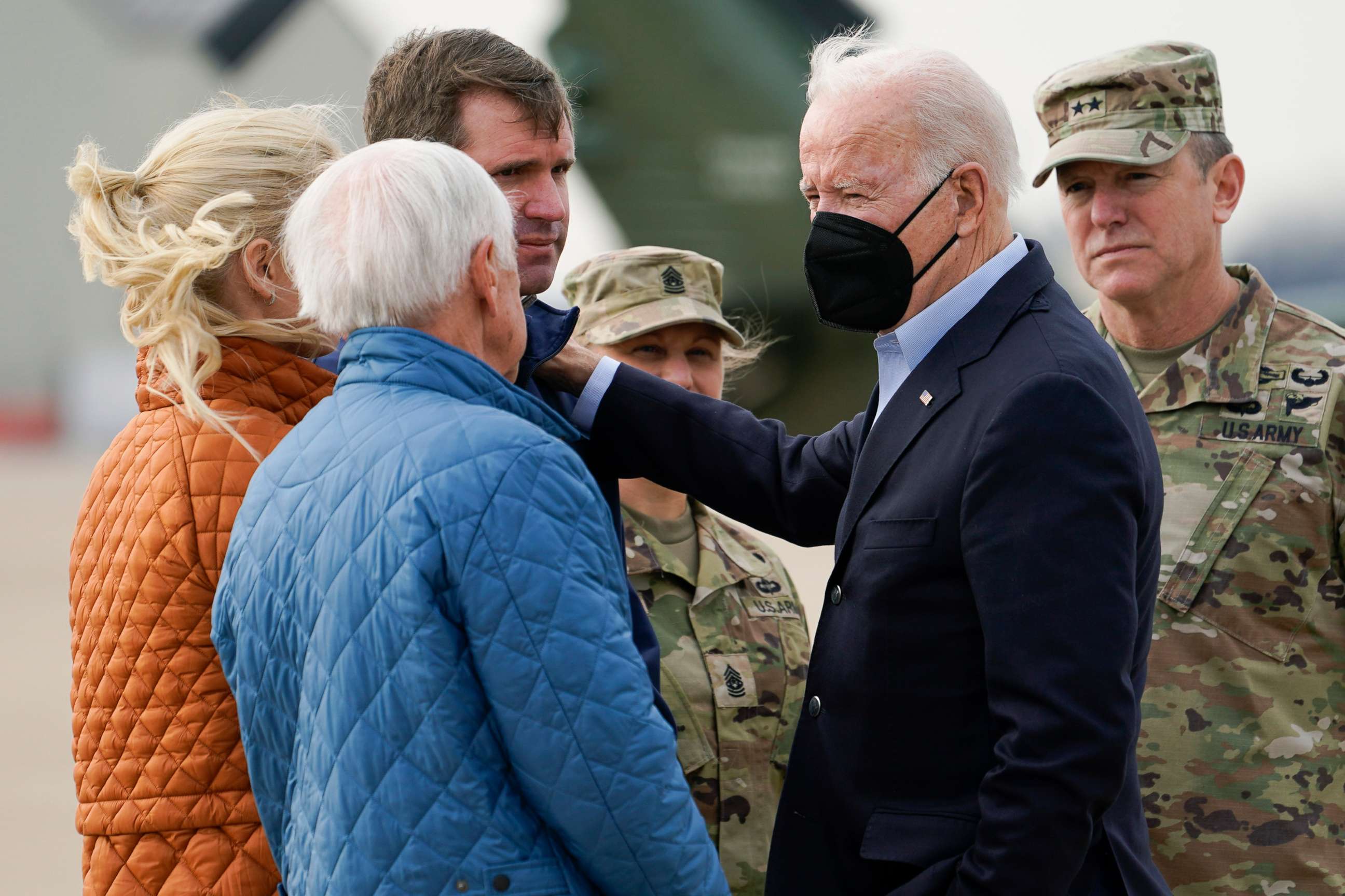 PHOTO: President Joe Biden greets Kentucky Gov. Andy Beshear and his wife Britainy Beshear as he arrives in Fort Campbell, Ky., Dec. 15, 2021, to survey storm damage from tornadoes and extreme weather. 