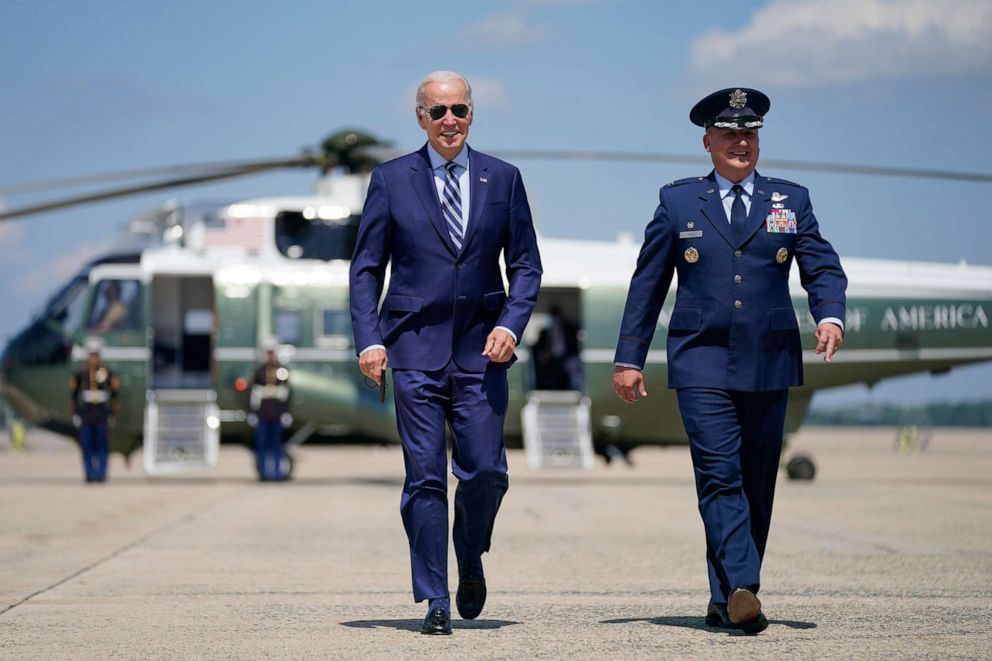 PHOTO: President Joe Biden walks toward Air Force One with Col. Matthew Jones, Commander, 89th Airlift Wing, Aug. 30, 2022, at Andrews Air Force Base, Md. 