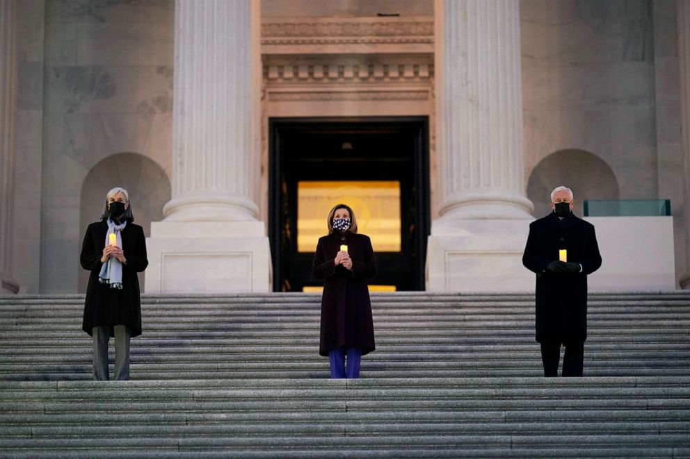 PHOTO: Speaker of the House Nancy Pelosi, D-Calif., center, and the House Democratic leadership, hold COVID-19 memorial and lighting ceremony on the steps of the Capitol, Jan. 19, 2021. 