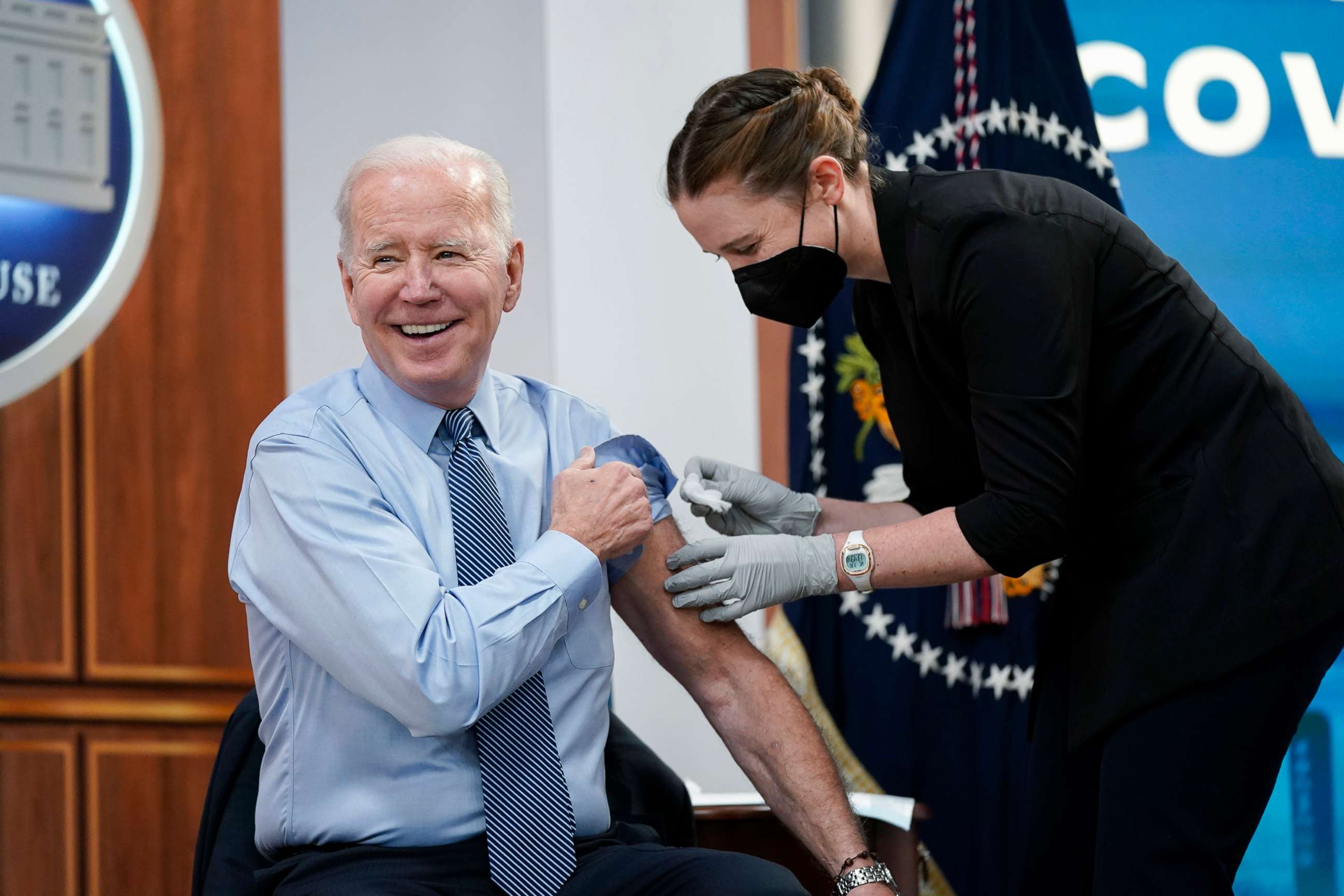 PHOTO: President Joe Biden smiles after receiving his second COVID-19 booster shot in the South Court Auditorium on the White House campus, March 30, 2022.