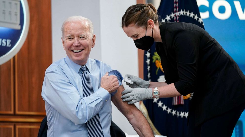 PHOTO: President Joe Biden smiles after receiving his second COVID-19 booster shot in the South Court Auditorium on the White House campus, March 30, 2022.