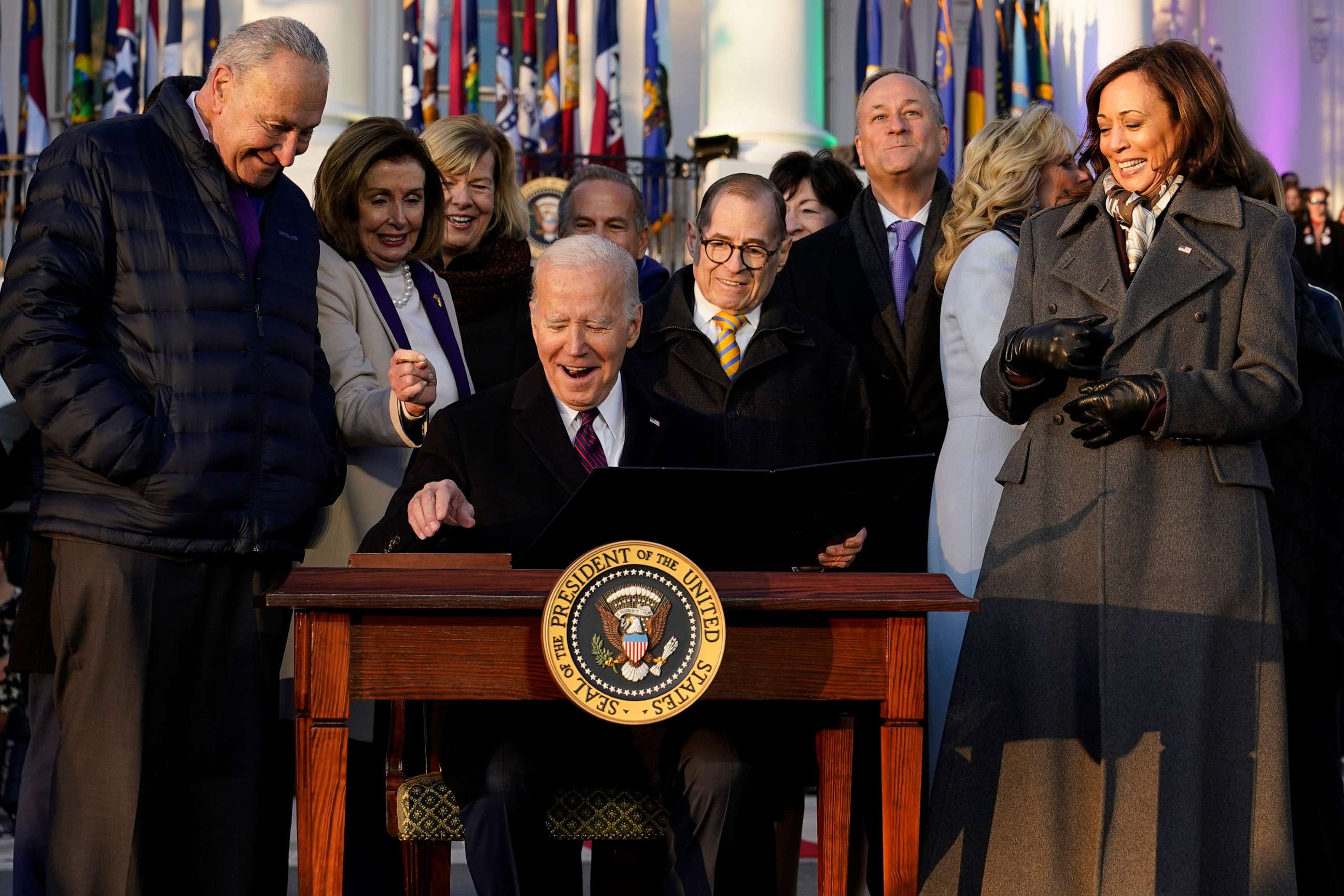 PHOTO: President Joe Biden reacts after signing the Respect for Marriage Act, Dec. 13, 2022, on the South Lawn of the White House.