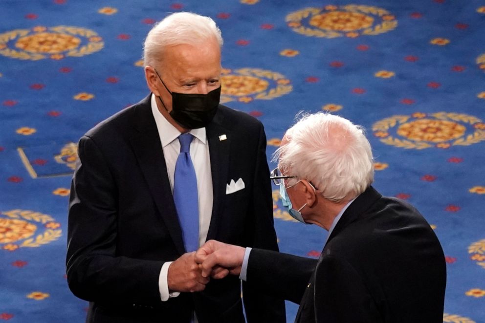 PHOTO: FILE - In this April 28, 2021 file photo, President Joe Biden greets Sen. Bernie Sanders, I-Vt., as Biden arrives to speak to a joint session of Congress  in the House Chamber at the U.S. Capitol in Washington. 