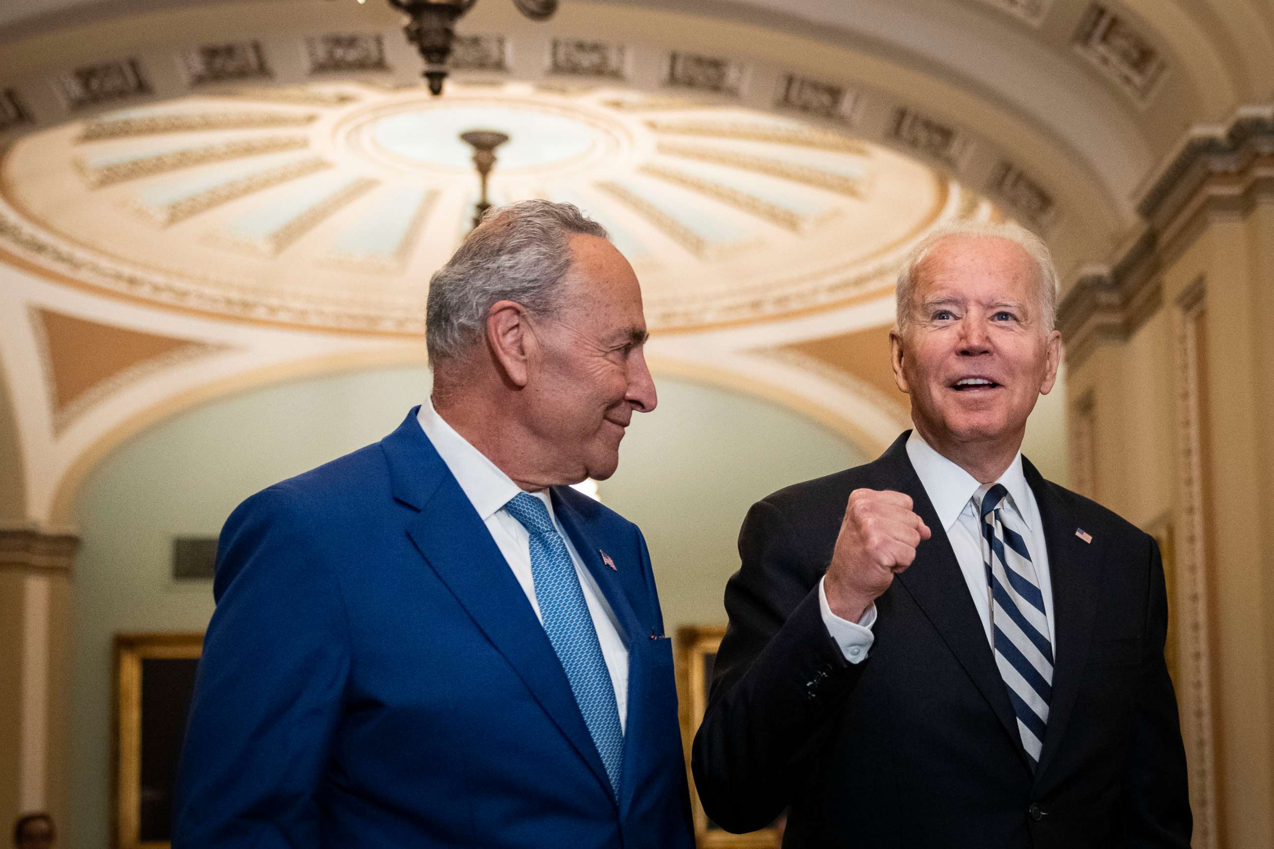 PHOTO: Senate Majority Leader Chuck Schumer and President Joe Biden speak briefly to reporters as they arrive at the U.S. Capitol for a Senate Democratic luncheon July 14, 2021 in Washington.