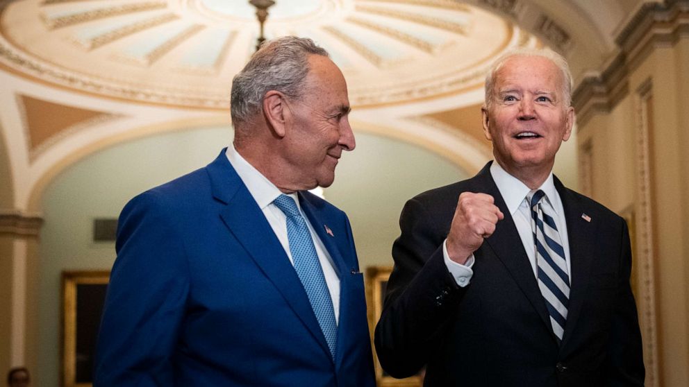 PHOTO: Senate Majority Leader Chuck Schumer and President Joe Biden speak briefly to reporters as they arrive at the U.S. Capitol for a Senate Democratic luncheon July 14, 2021 in Washington.