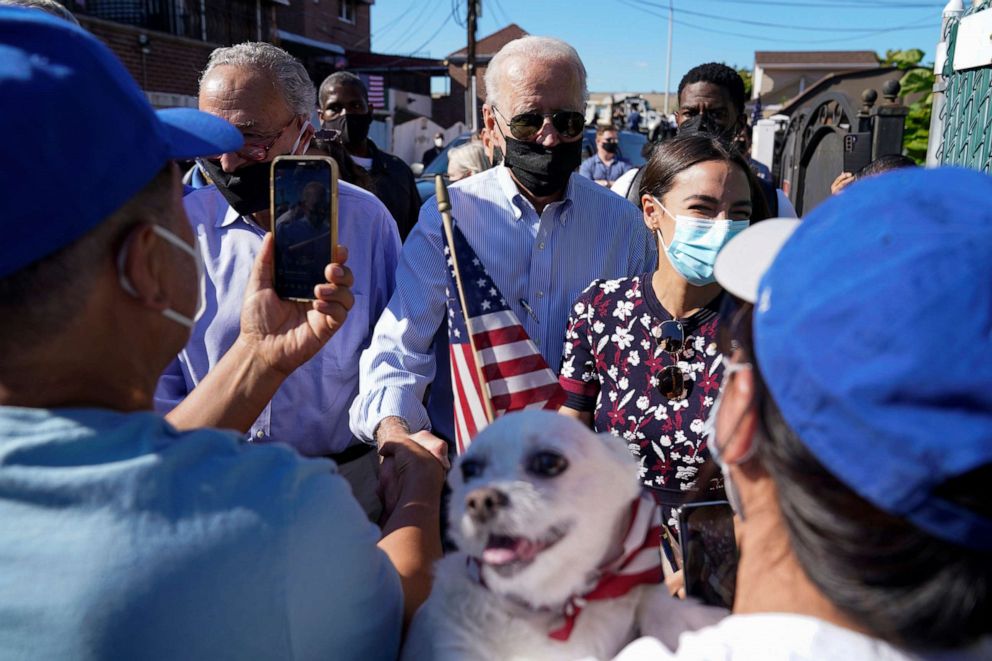 PHOTO: President Joe Biden talks with people as he tours a neighborhood impacted by flooding from the remnants of Hurricane Ida, Sept. 7, 2021, in the Queens borough of New York. 