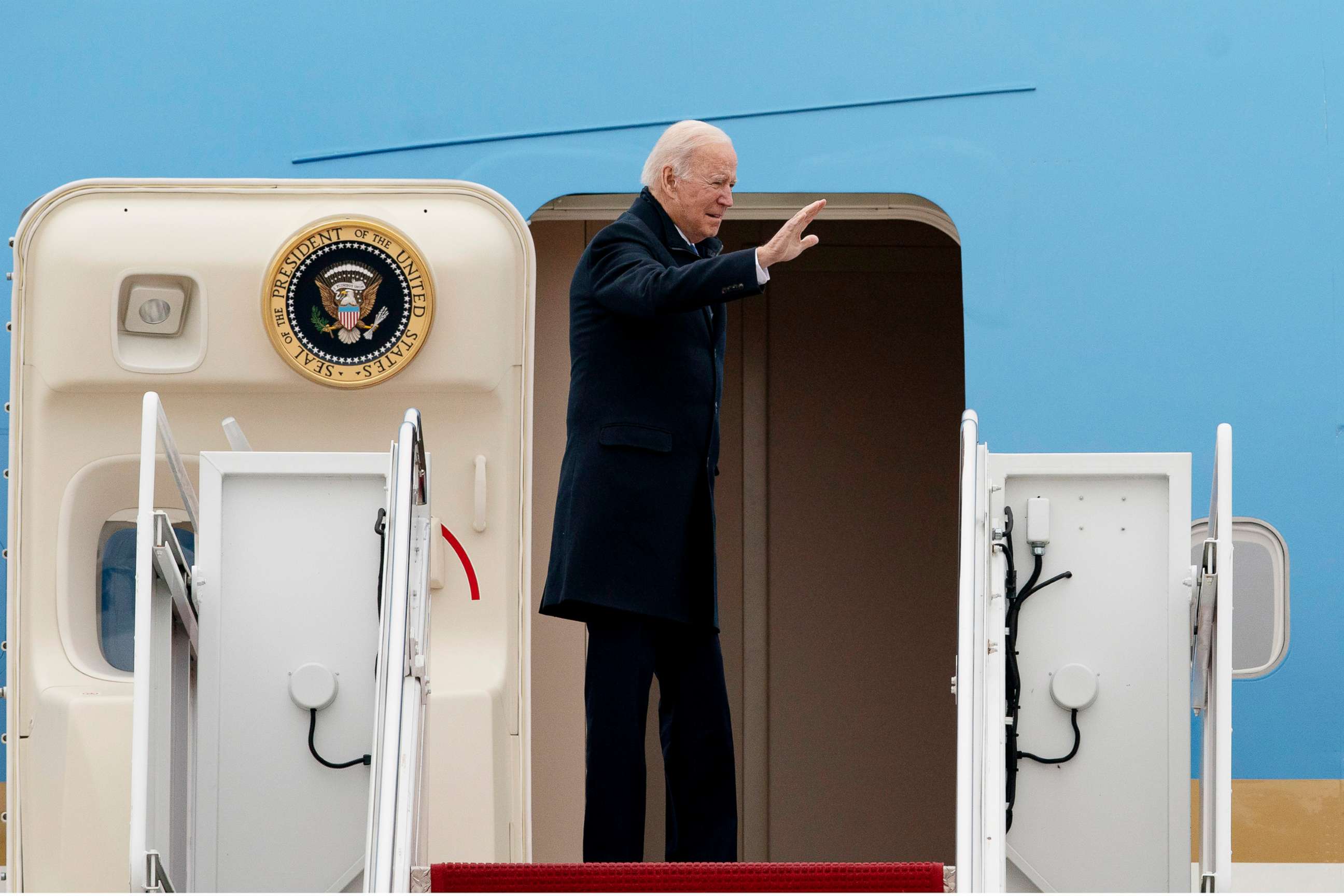 PHOTO: President Joe Biden waves as he boards Air Force One for a trip to Kansas City, Mo., Dec. 8, 2021, at Andrews Air Force Base, Md. 