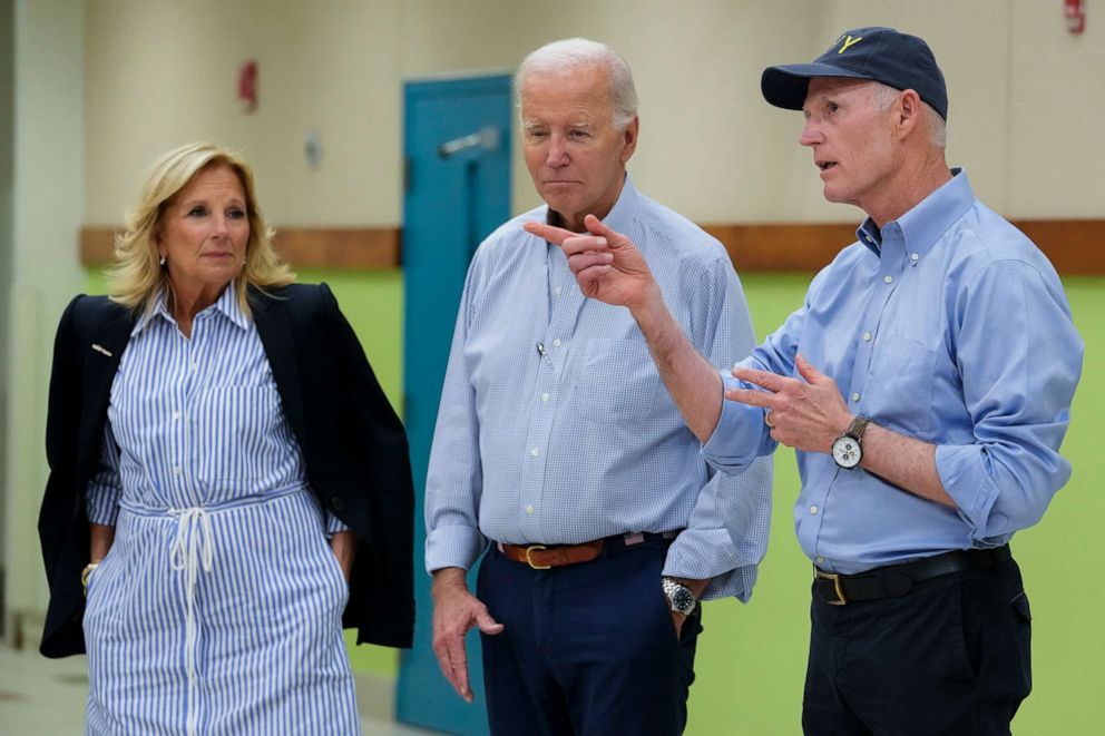 PHOTO: President Joe Biden and first lady Jill Biden listen as Sen. Rick Scott, R-Fla., speaks at Suwannee Pineview Elementary School, Saturday, Sept. 2, 2023, in Live Oak, Fla. (AP Photo/Julio Cortez)