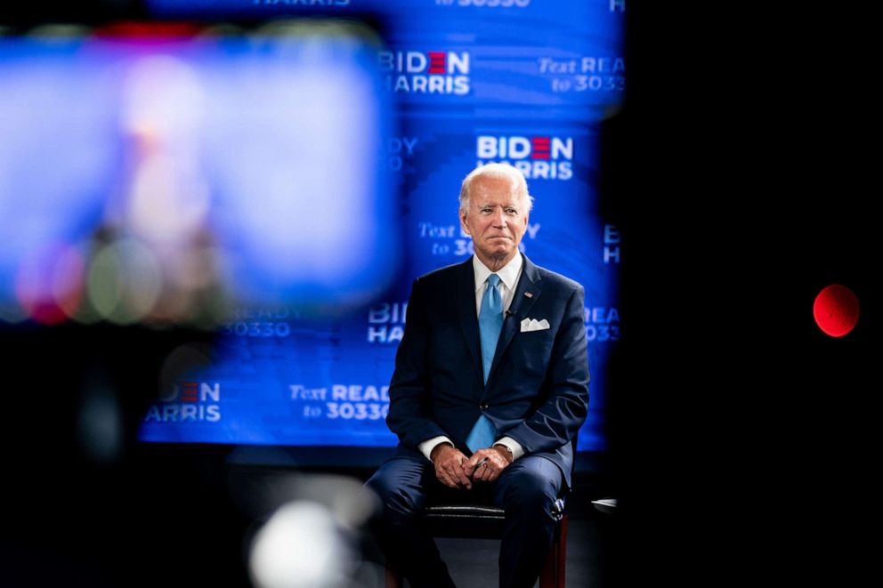 PHOTO: Joe Biden listens as Sen. Kamala Harris spoke at her official unveiling as his running mate, in Wilmington, Del., Aug. 12, 2020.