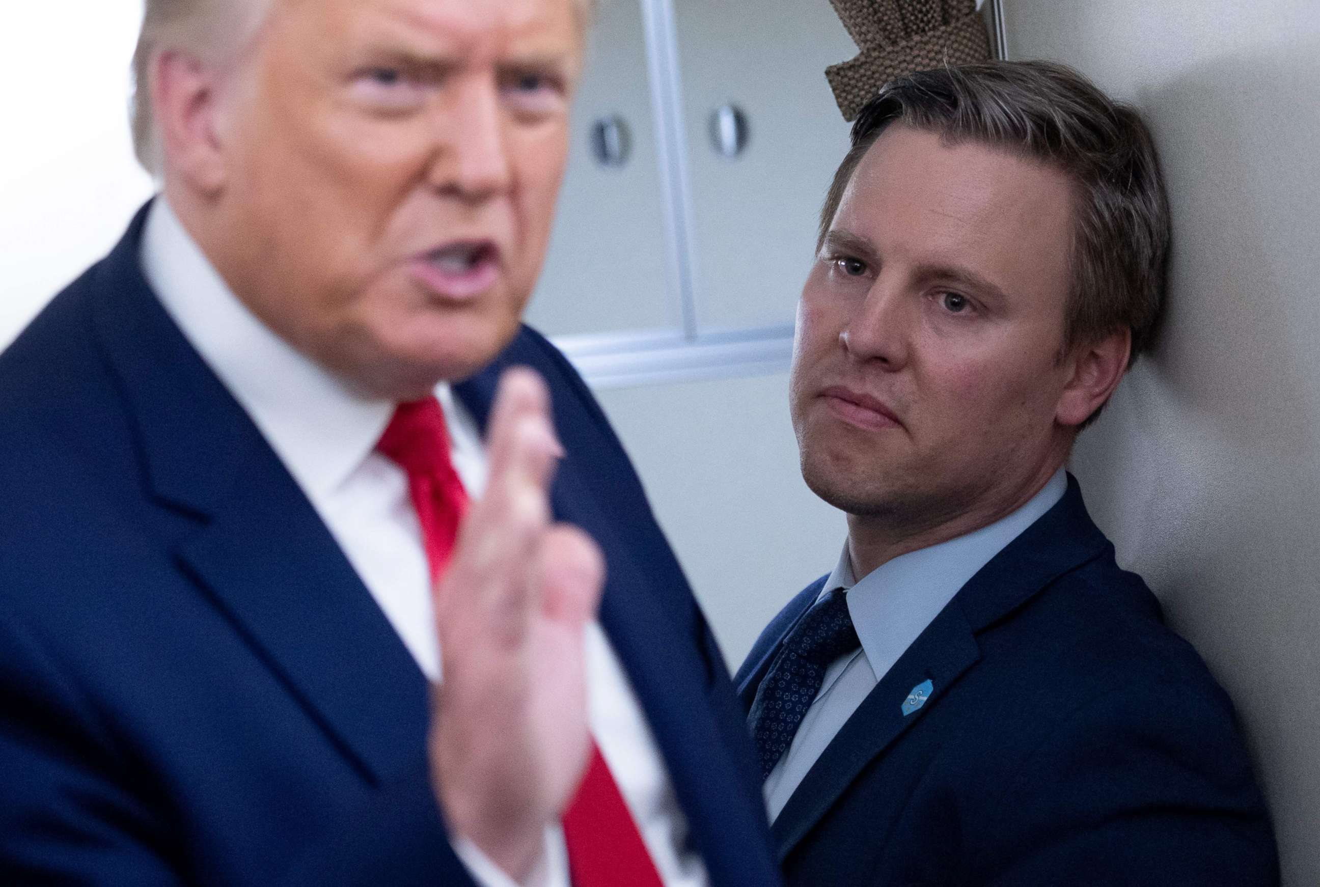 PHOTO: (FILES) In this file photo taken on August 28, 2020 Campaign manager Bill Stepien stands alongside US President Donald Trump as he speaks with reporters aboard Air Force One.