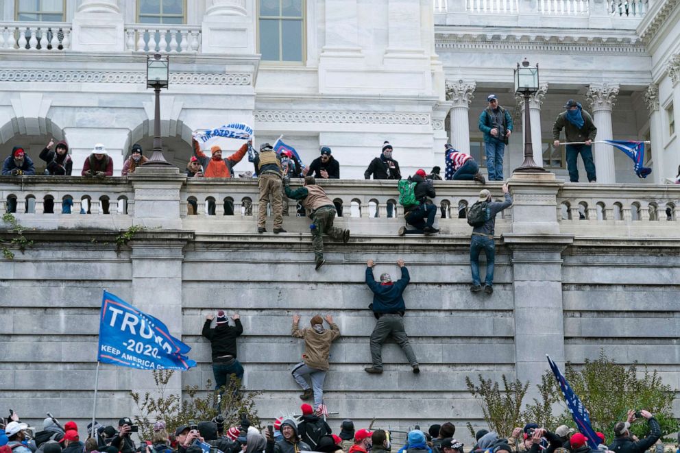 PHOTO: Insurrectionists loyal to President Donald Trump climb the west wall of the Capitol, Jan. 6, 2021.