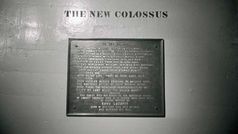 PHOTO: A plaque with a poem entitled "The New Colossus" by Emma Lazarus located on the base of the Statue of Liberty.