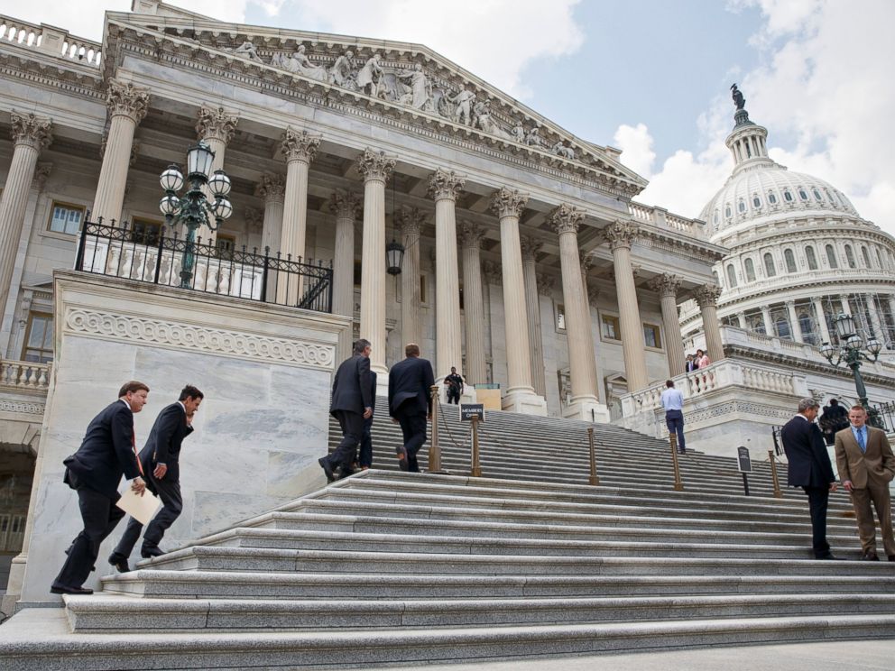 PHOTO: Members Congress clinb the steps of the House of Representatives for final votes, at the Capitol in Washington, Thursday, July 31, 2014.