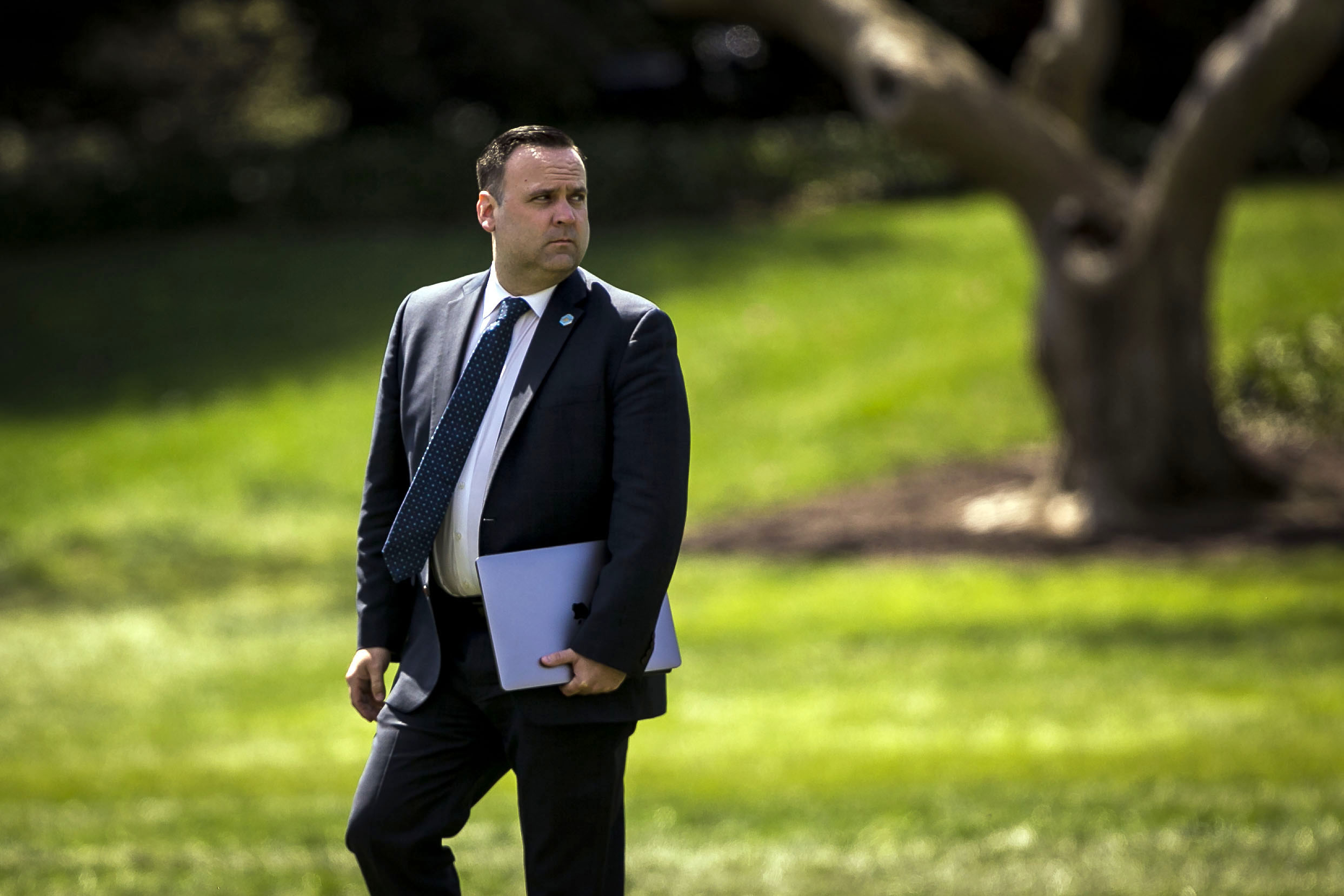 PHOTO: Dan Scavino Jr., White House director of social media, walks on the South Lawn of the White House before boarding Marine One in Washington, on April 5, 2018.