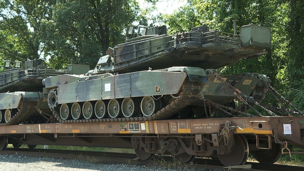 PHOTO: Two M1 Abrams tanks and two Bradley Fighting Vehicles transported to Washington DC for July 4 festivities are seen at a rail head in Washington D.C. 