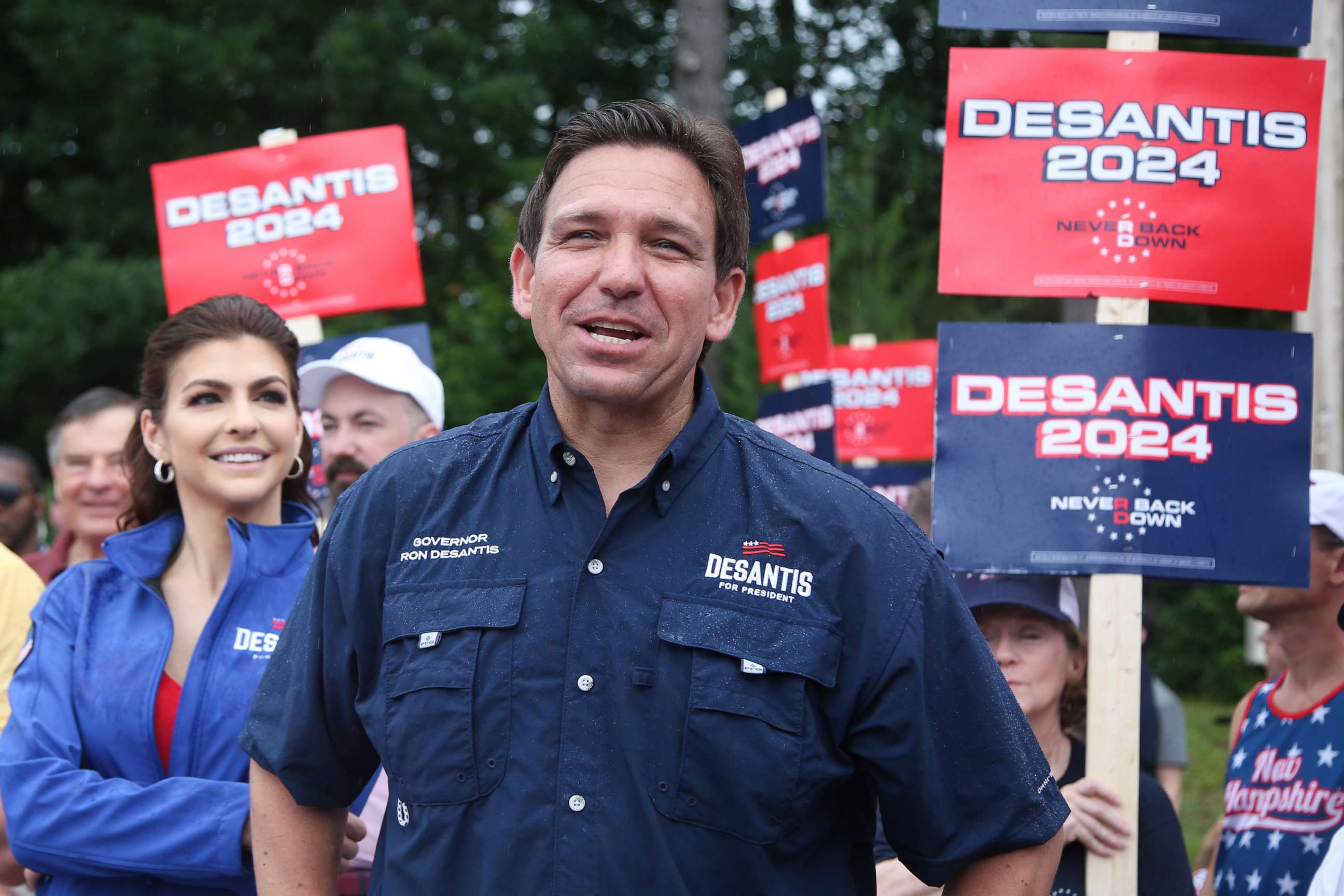 PHOTO: Republican presidential candidate and Florida Gov. Ron DeSantis and his wife Casey, walk in the July 4th parade, July 4, 2023, in Merrimack, N.H.