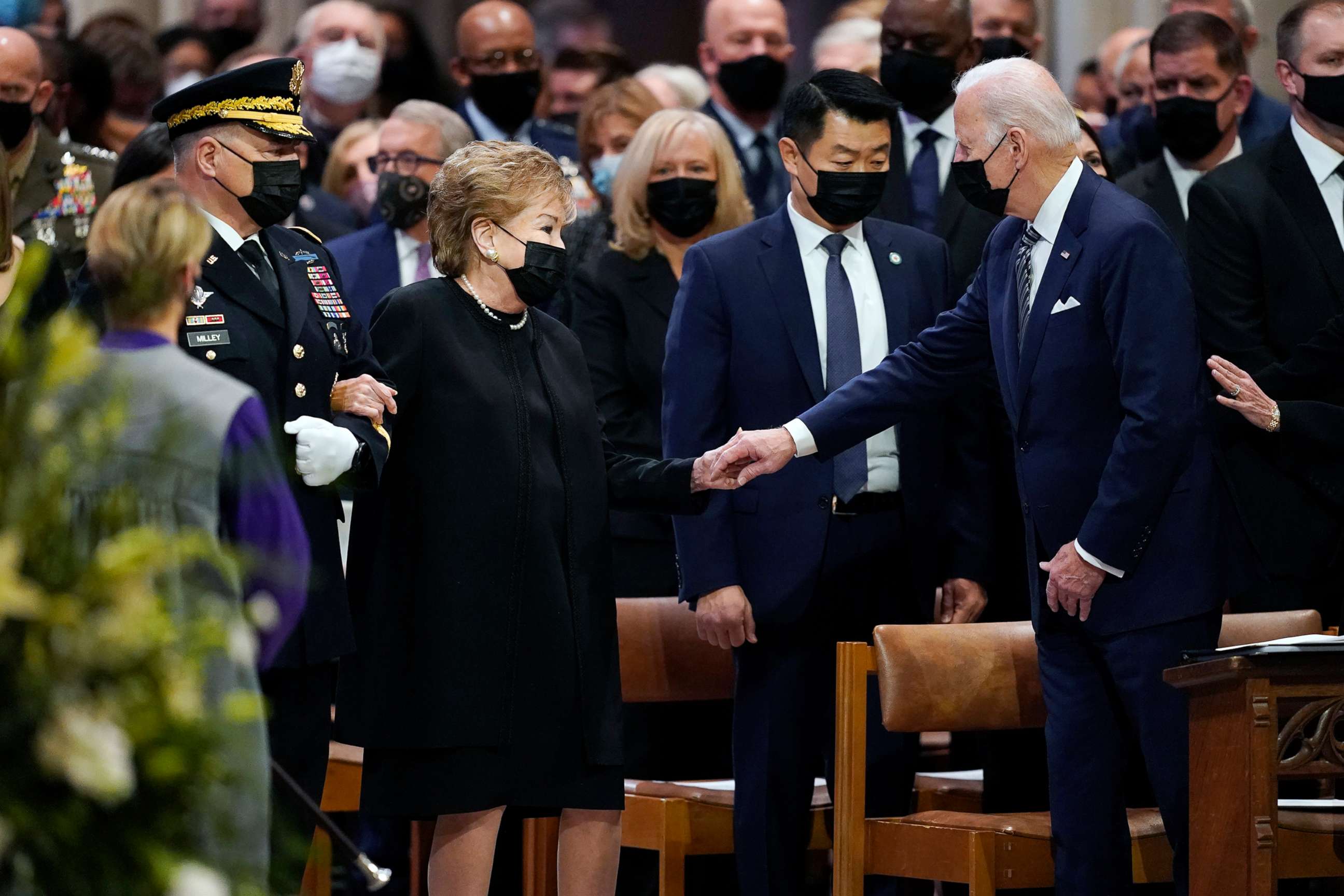 PHOTO: President Joe Biden greets Sen. Elizabeth Dole, accompanied by Chairman of the Joint Chiefs Mark Milley, left, as she arrives at the funeral for her husband, former Sen. Bob Dole.