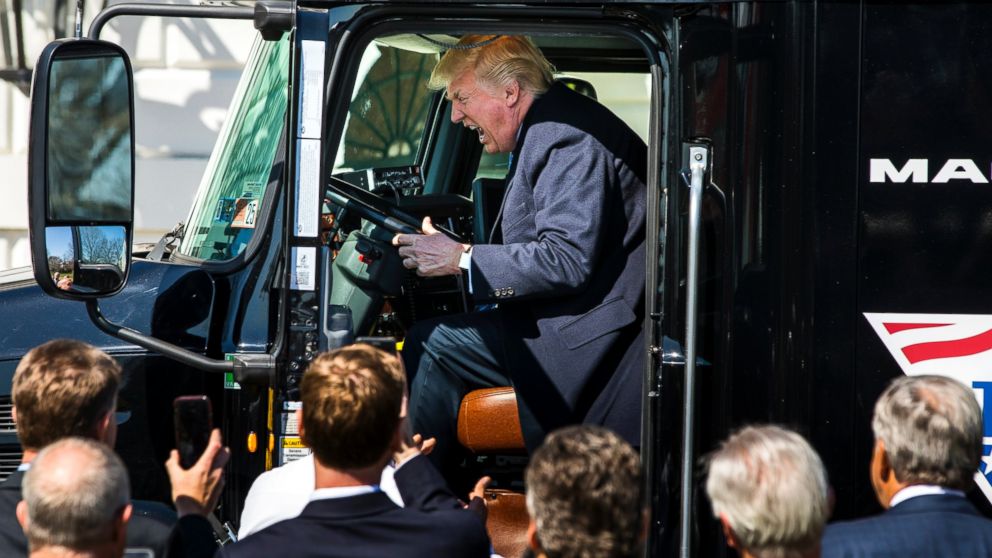 PHOTO: U.S. President Donald J. Trump gets in the driver's seat of an 18-wheeler while meeting with truck drivers and trucking CEOs on the South Portico prior to their meeting to discuss health care at the White House in Washington, March 23, 2017.