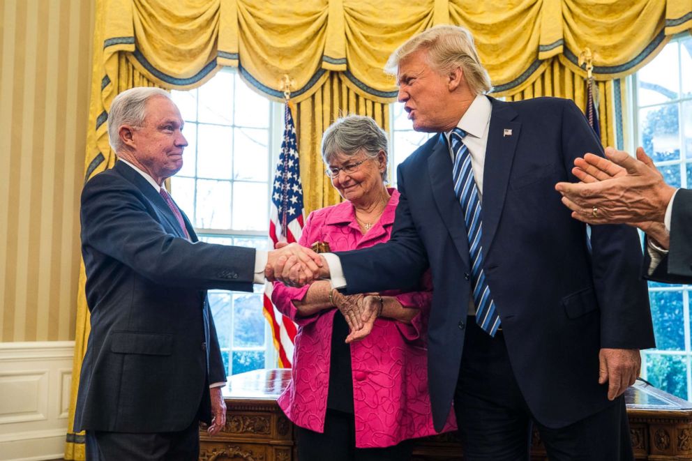 PHOTO: President Donald J. Trump shakes hands with Attorney General Jeff Sessions while Sessions' wife, Mary Blackshear Sessions looks on shortly after Sessions was sworn by Vice President Mike Pence in Washington, Feb. 9, 2017. 