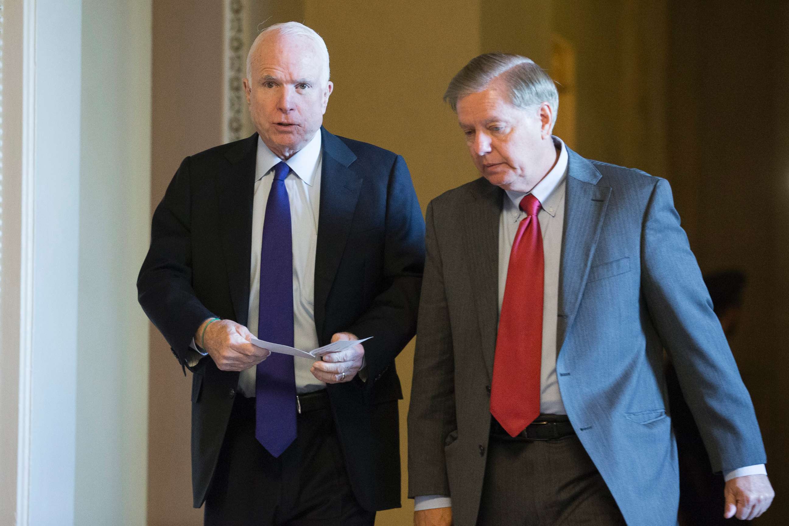 PHOTO: Sen. John McCain and Sen. Lindsey Graham walk near the Senate chamber following Senate Republican elections on Capitol Hill in Washington, in this file photo dated Nov. 16, 2016.