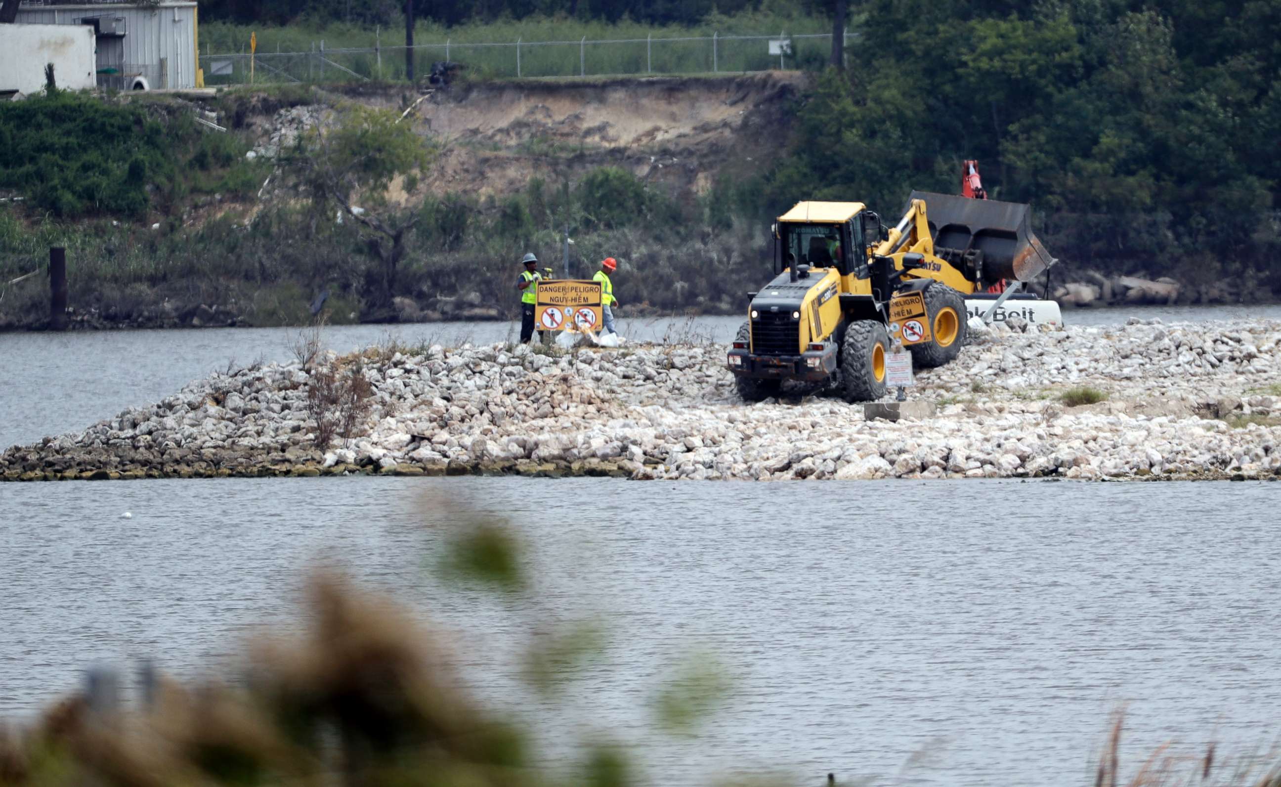 PHOTO: Workers are shown at San Jacinto River Waste Pits in Channelview, Texas, Sept. 13, 2017..  The EPA says an unknown amount of a dangerous chemicals may have washed downriver from this Superfund site during the flooding from Hurricane Harvey.  