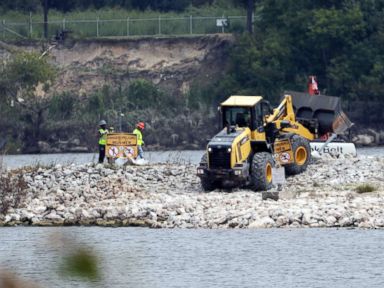 PHOTO: Workers are shown at San Jacinto River Waste Pits in Channelview, Texas, Sept. 13, 2017.. The EPA says an unknown amount of a dangerous chemicals may have washed downriver from this Superfund site during the flooding from Hurricane Harvey.