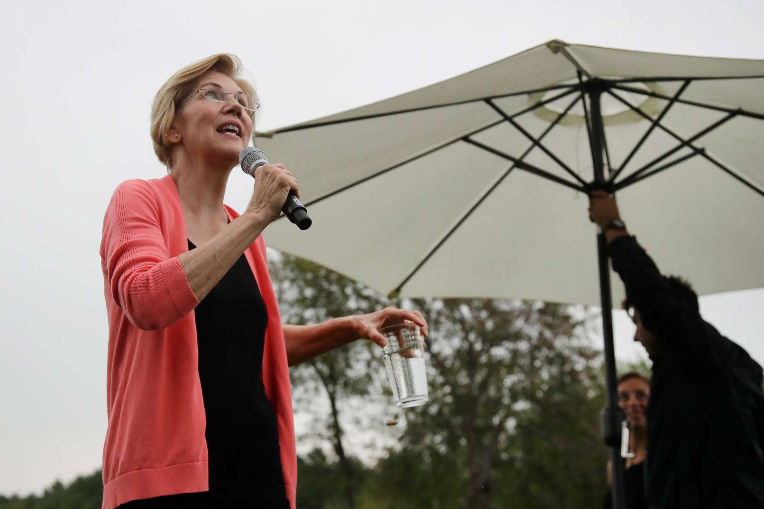 PHOTO: Democratic presidential candidate Sen. Elizabeth Warren, D-Mass., looks up at the rain as an umbrella is set up during a campaign event, Monday, Sept. 2, 2019, in Hampton Falls, N.H.