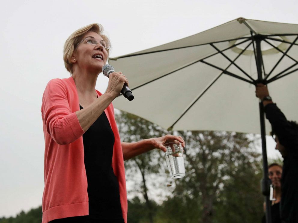 PHOTO: Democratic presidential candidate Sen. Elizabeth Warren, D-Mass., looks up at the rain as an umbrella is set up during a campaign event, Monday, Sept. 2, 2019, in Hampton Falls, N.H.