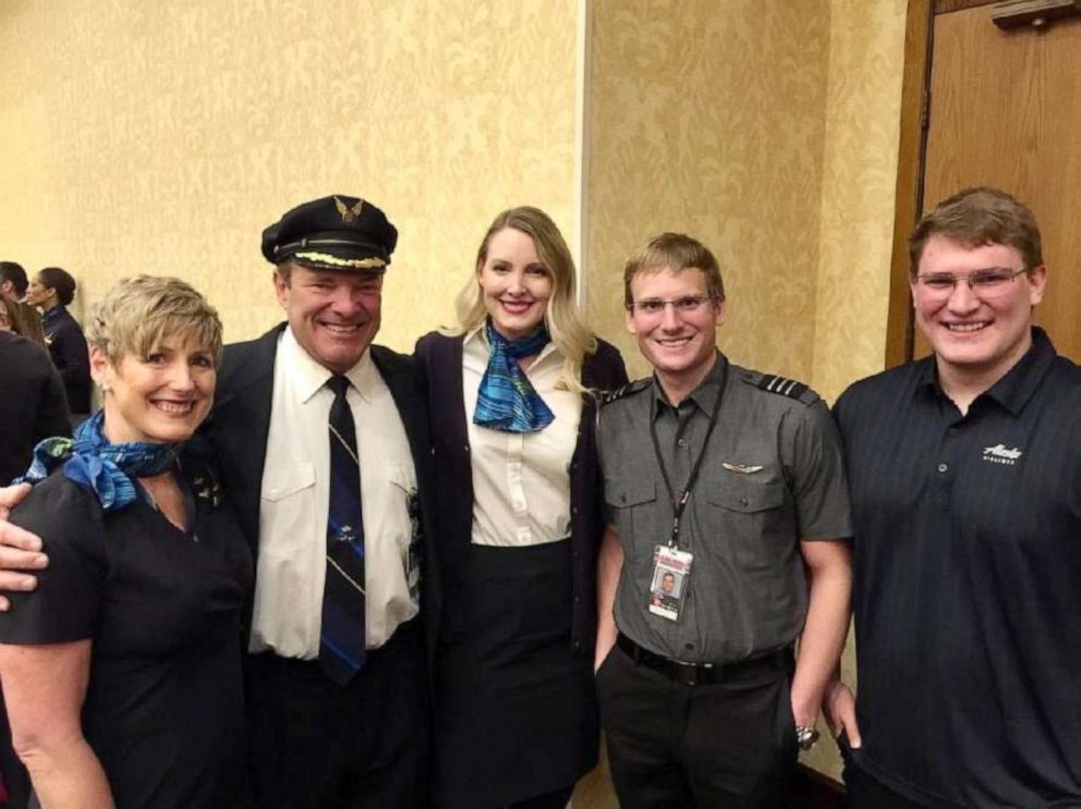 PHOTO: Captain Lee Erickson and Flight Attendant Brenda Erickson pose with their children who are a flight attendant, first officer, and intern at Alaska Airlines.