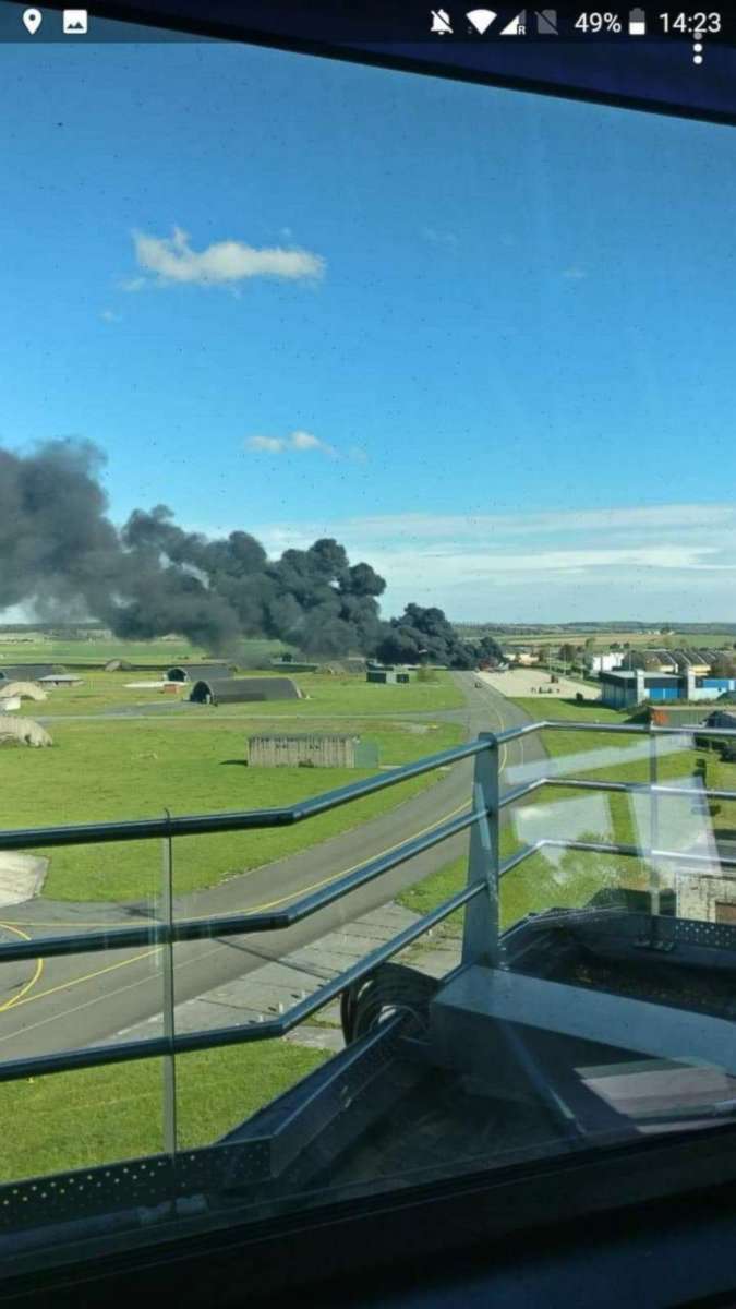 PHOTO: A cloud of smoke at Florennes Air Base in Belgium after the Belgian Air Force F-16 was accidentally struck by cannon fire by another F-16 on the tarmac.