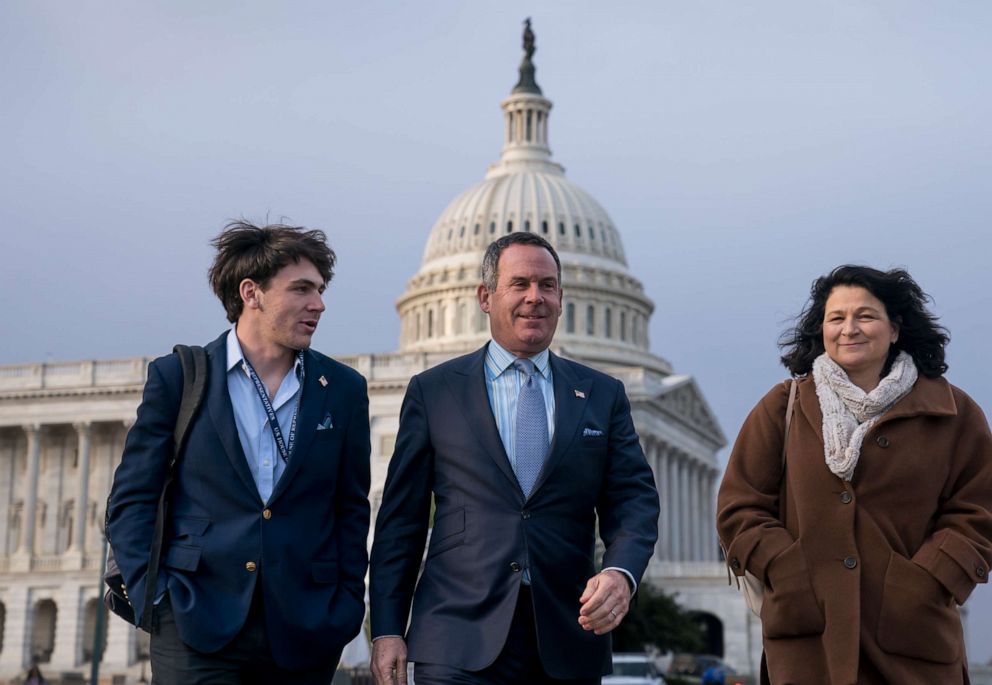 PHOTO: Adam Frisch of Aspen, Colo., center, the Democrat who opposed Rep. Lauren Boebert, R-Colo., in Colorado's 3rd congressional district, walks with his son Felix Frisch, left, and his wife Katy Frisch, right , at the Capitol, November 18, 2022. 