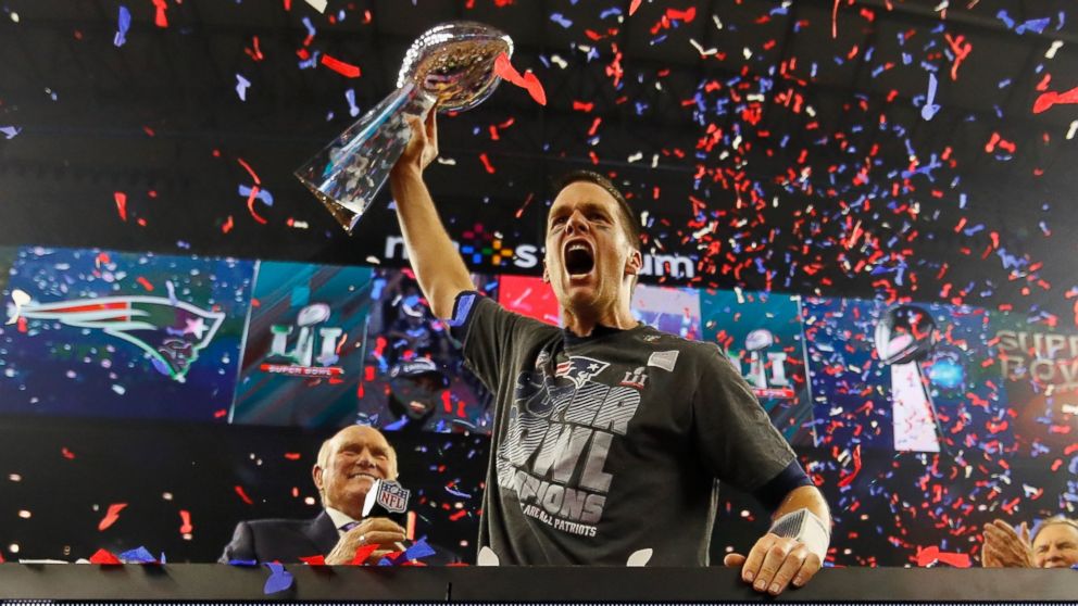 PHOTO: Quarterback Tom Brady of the New England Patriots raises the Vince Lombardi Trophy after defeating the Atlanta Falcons during Super Bowl 51, February 5, 2017 in Houston, Texas.