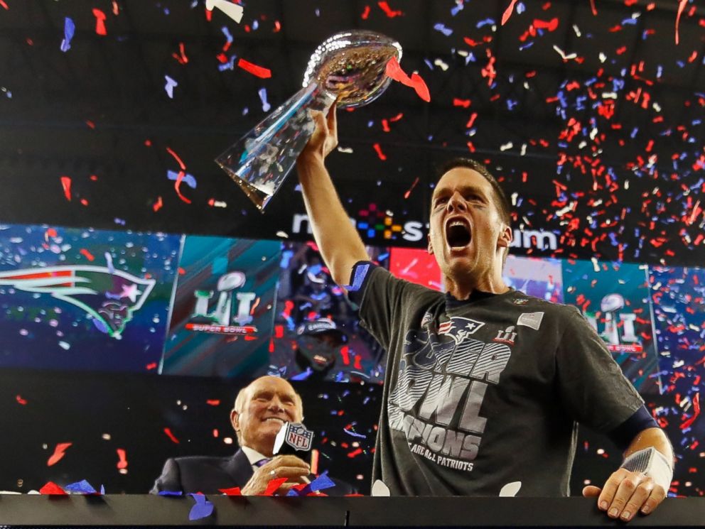 PHOTO: Quarterback Tom Brady of the New England Patriots raises the Vince Lombardi Trophy after defeating the Atlanta Falcons during Super Bowl 51, February 5, 2017 in Houston, Texas.