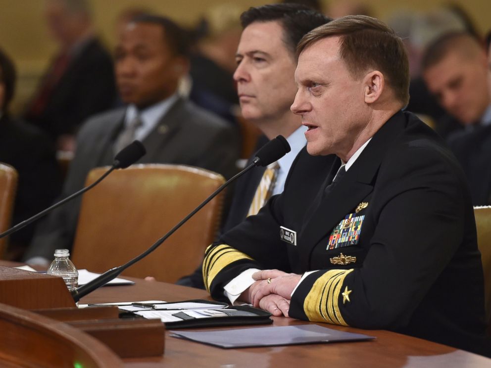 PHOTO: FBI Director James Comey (L) looks on as National Security Agency Director Mike Rogers speaks during the House Permanent Select Committee on Intelligence hearing, on March 20, 2017, on Capitol Hill in Washington.