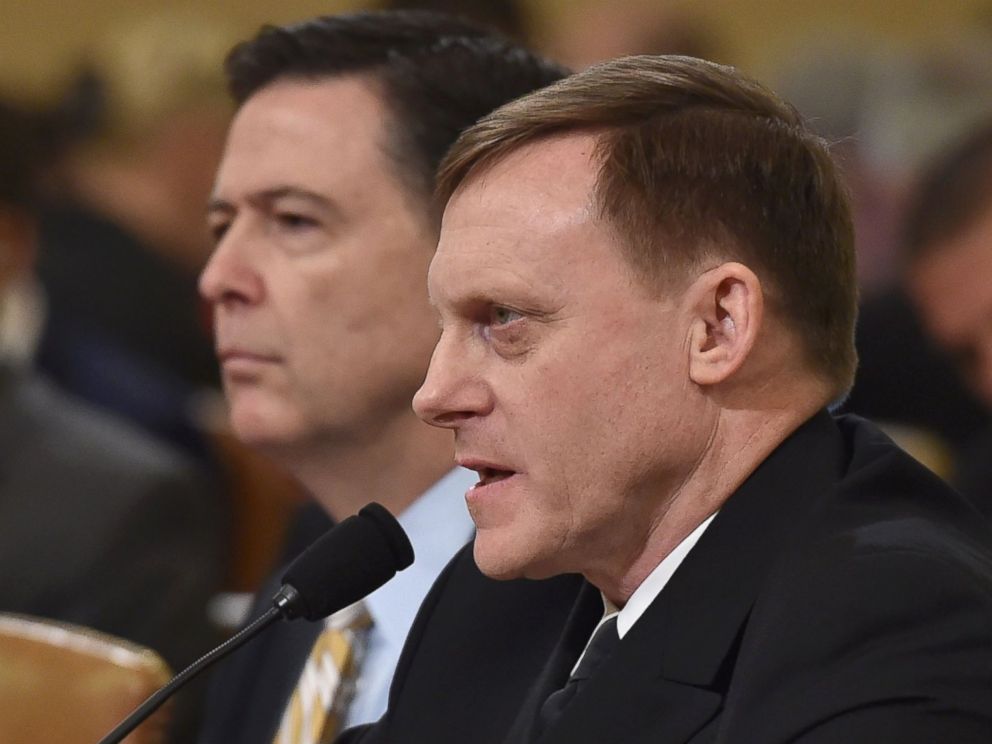 PHOTO: FBI Director James Comey (L) looks on as National Security Agency Director Mike Rogers speaks during the House Permanent Select Committee on Intelligence hearing, on March 20, 2017, on Capitol Hill in Washington. 
