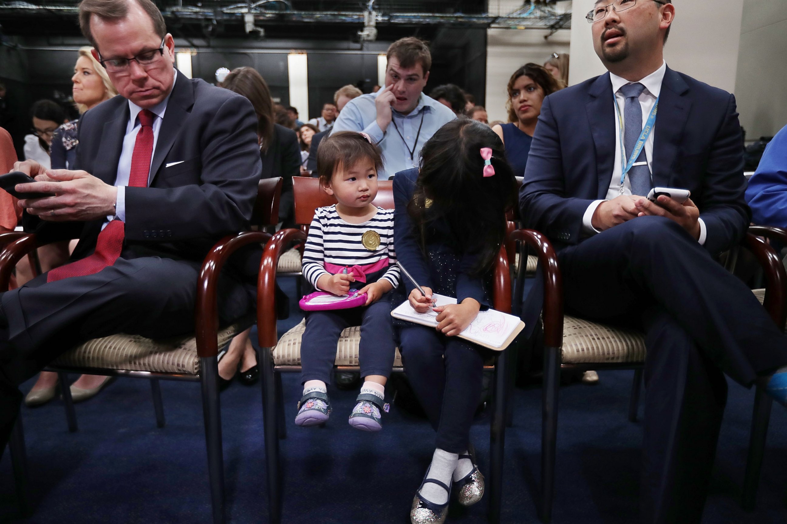 PHOTO: The Hill reporter Scott Wong, right, sits with his daughters, Olivia and Abby, who participated in Take Our Daughters and Sons To Work Day as many journalists took their children to the U.S. Capitol. 