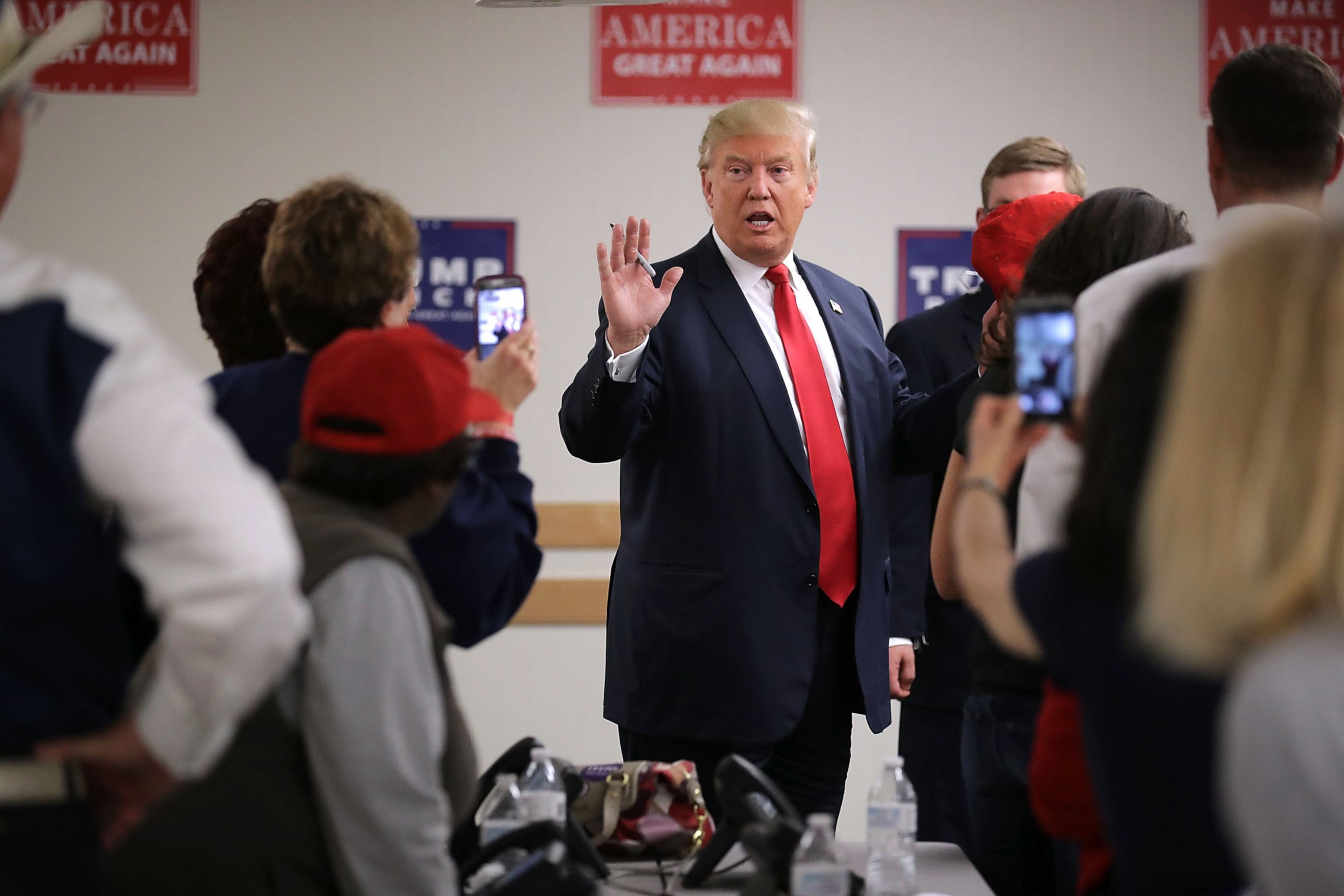 PHOTO: Republican presidential nominee Donald Trump talks with volunteers at a campaign phone bank before a rally at the Bank of Colorado Arena on the campus of University of Northern Colorado, Oct. 30, 2016 in Greeley, Colorado. 