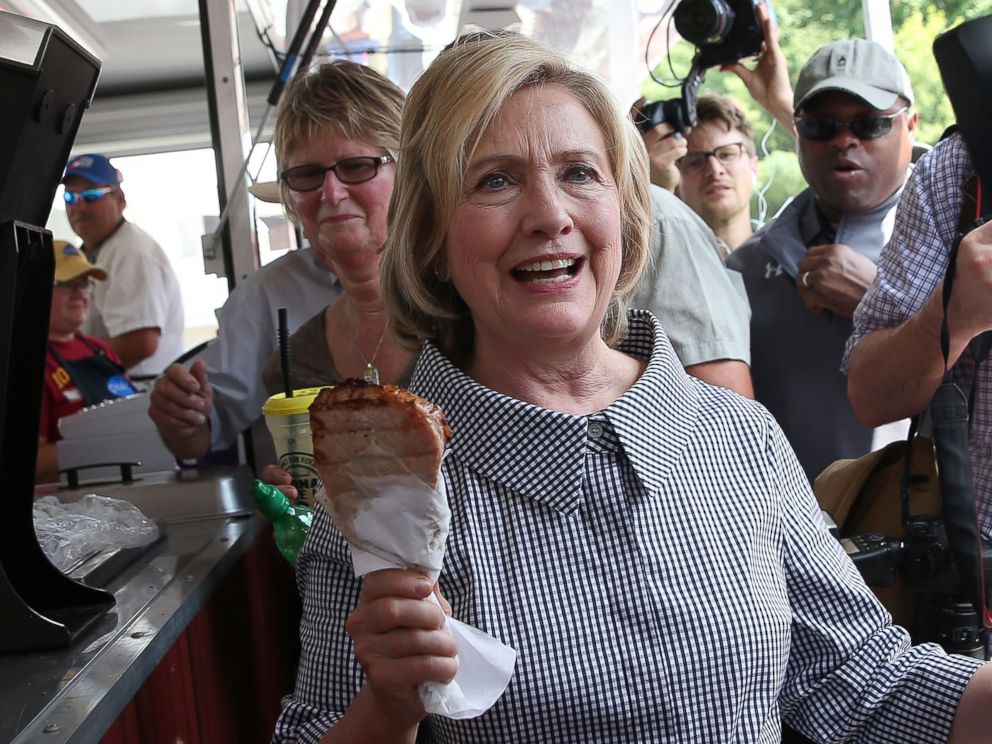 PHOTO: Democratic presidential hopeful and former Secretary of State Hillary Clinton holds a Pork Chop on a Stick as she tours the Iowa State Fair, on Aug. 15, 2015, in Des Moines, Iowa.  