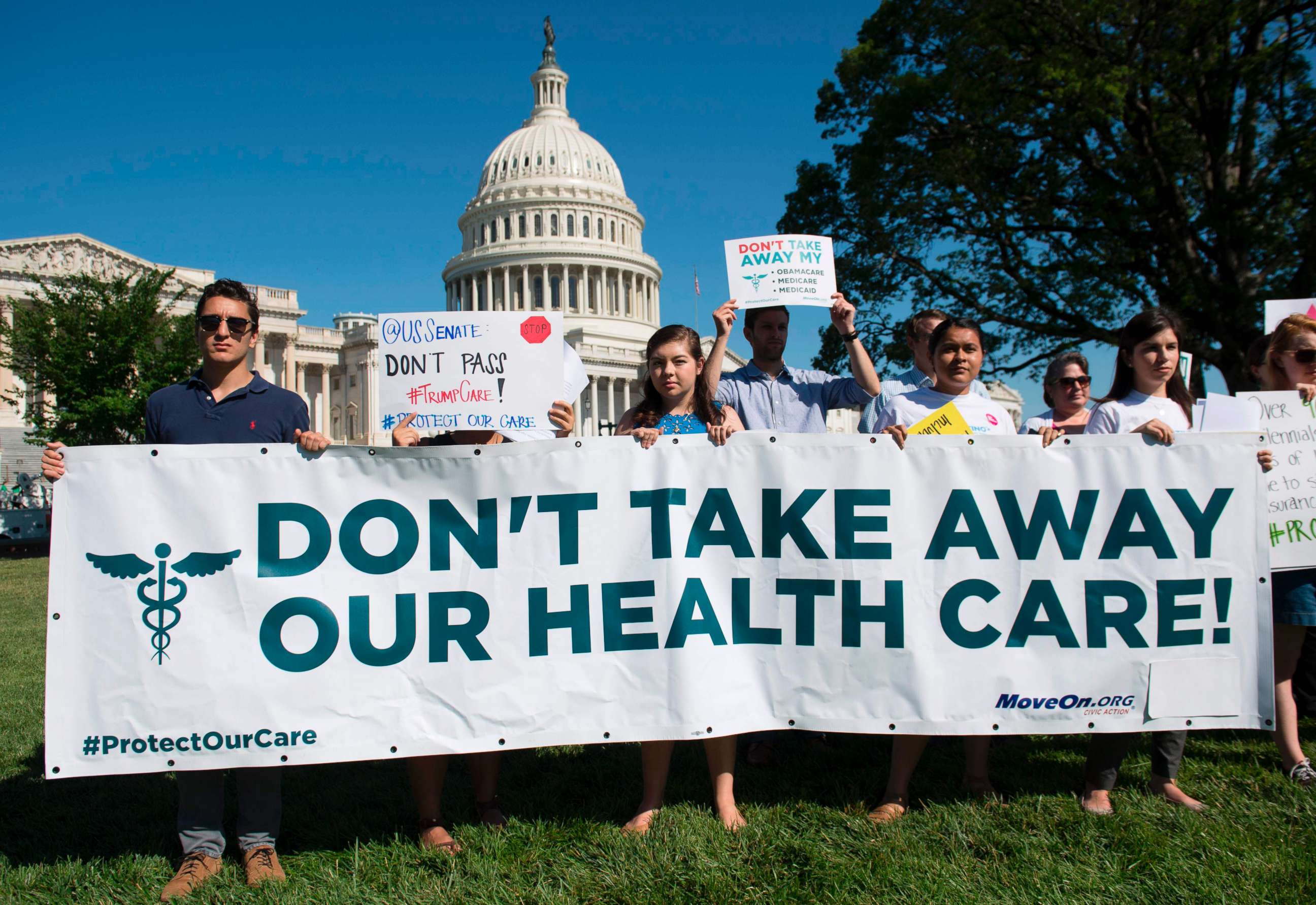 PHOTO: Protesters against the US Senate Republicans' healthcare bill hold a rally outside the US Capitol in Washington, DC, June 28, 2017. 