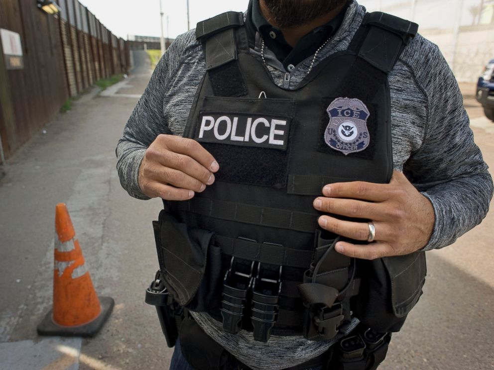 PHOTO: A U.S. Immigration and Customs Enforcement (ICE) agent waits as an undocumented man, not pictured, is deported to Mexico at the U.S. and Mexico border in San Diego, Calif., on Feb. 26, 2015.