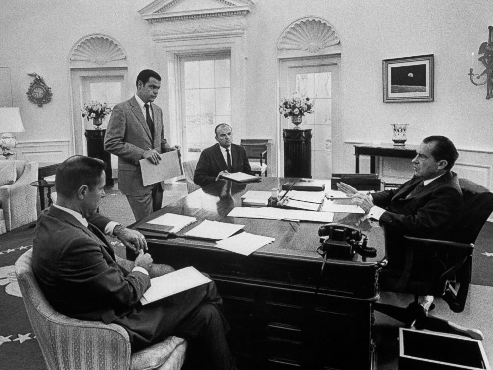 PHOTO: President Richard Nixon sits at his desk in the Oval Office during a meeting with aides (L-R) H.R. Haldeman, Dwight Chapin and John Ehrlichman, May 13, 1970, in Washington. 