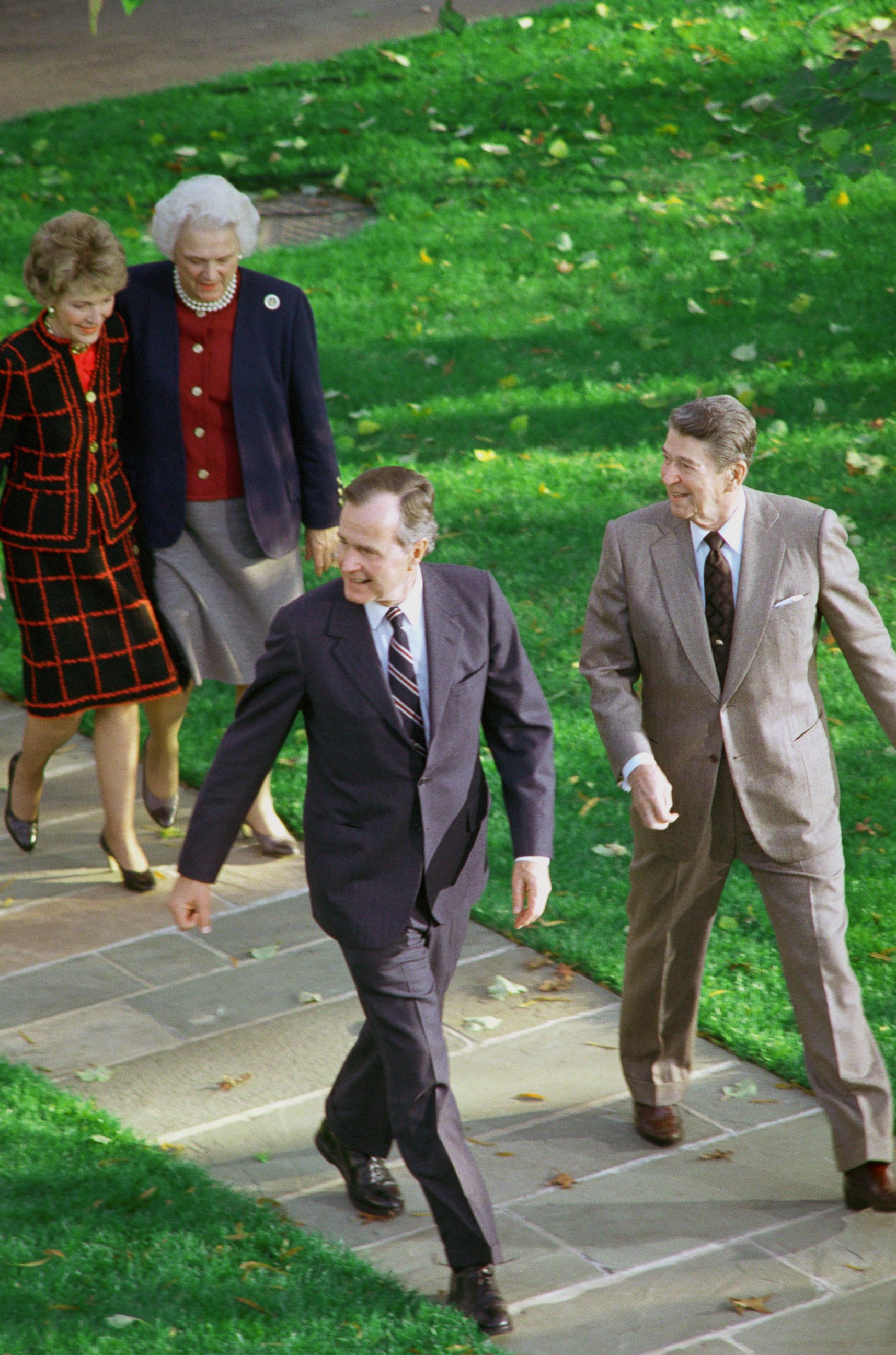 PHOTO: President Ronald Reagan with President-elect George Bush, accompanied by their wives, Barbara Bush and Nancy Reagan, as they headed for the Oval Office November 9, 1988 after Bush's arrival at the White House.