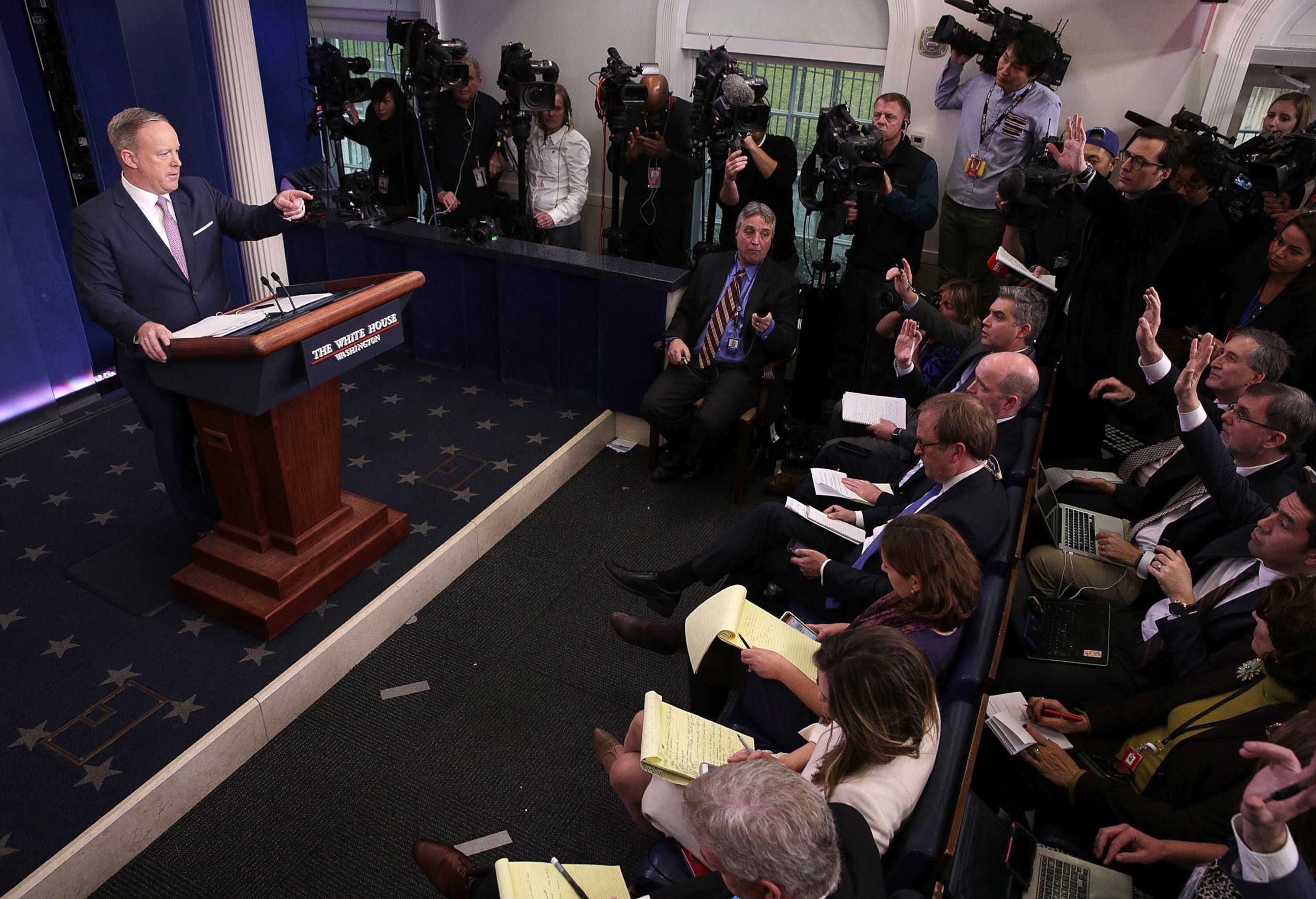 PHOTO: White House Press Secretary Sean Spicer (L) takes questions during a daily briefing at the James Brady Press Briefing Room of the White House January 23, 2017 in Washington. 