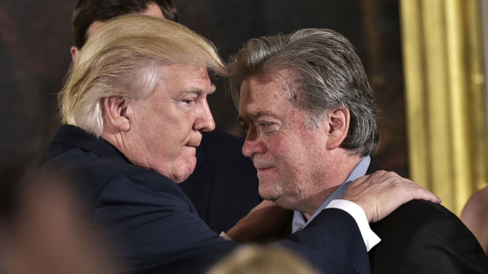 PHOTO: President Donald Trump congratulates Senior Counselor to the President Stephen Bannon during the swearing-in of senior staff in the East Room of the White House on January 22, 2017 in Washington, DC. 