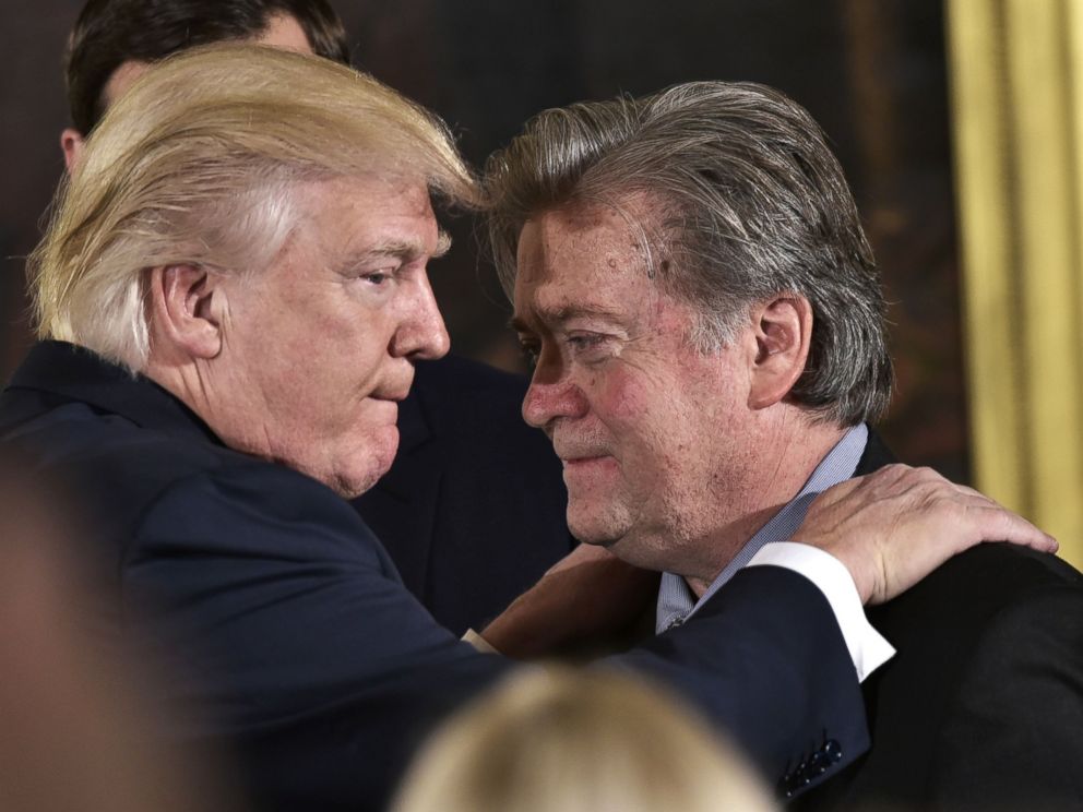 PHOTO: President Donald Trump congratulates Senior Counselor to the President Stephen Bannon during the swearing-in of senior staff in the East Room of the White House, Jan. 22, 2017 in Washington, D.C.