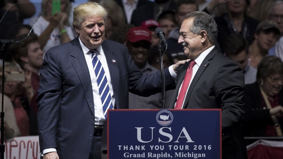 PHOTO: President-elect Donald Trump introduces Andrew N. Liveris, chief executive officer of The Dow Chemical Company and Trump's choice to be the head of a national manufacturing council, at the DeltaPlex Arena, Dec. 9, 2016, in Grand Rapids, Michigan. 