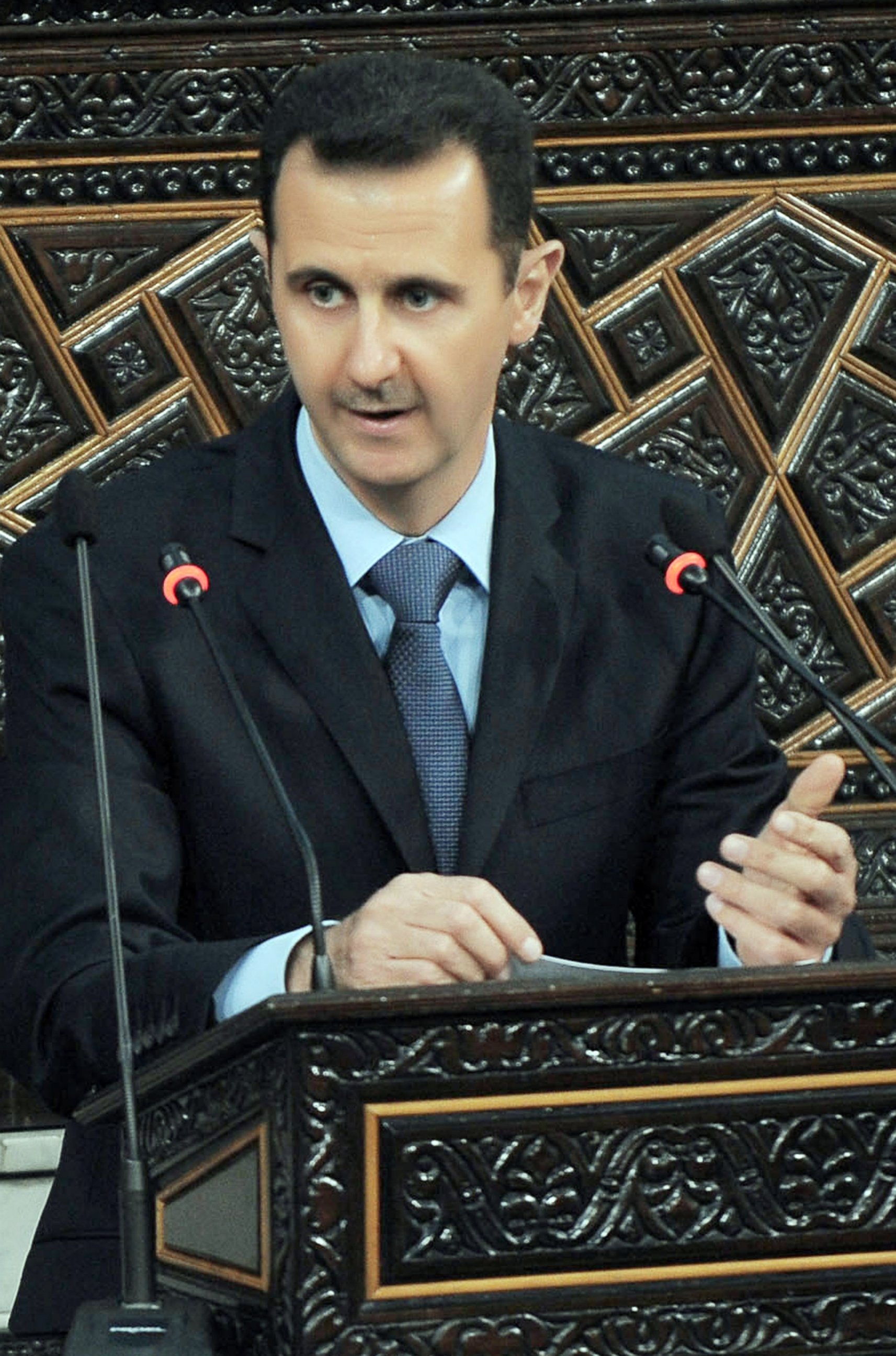PHOTO: Syrian President Bashar Al-Assad addresses the parliament in Damascus, Syria, March 30, 2011.